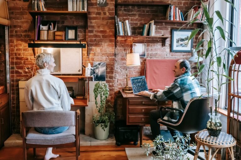 couple working remotely on a laptops representing how my remote work journey began