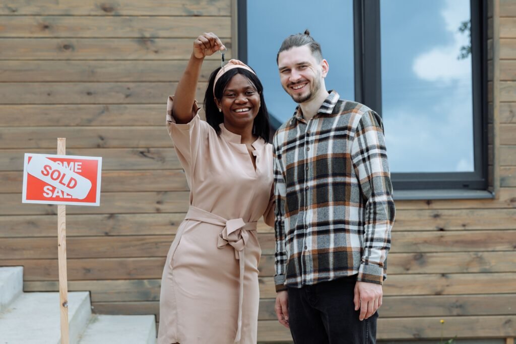 first time home buyer programs 2026 with new homeowner holding keys