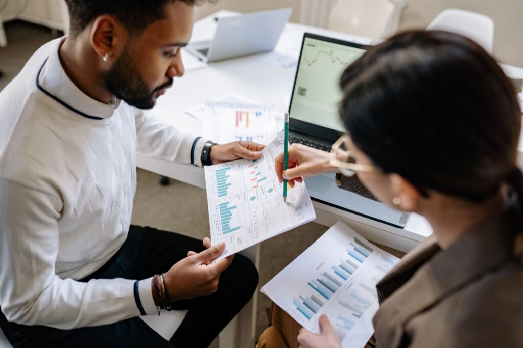 Credit repair steps - man reviewing financial charts to improve credit score and take control of debt